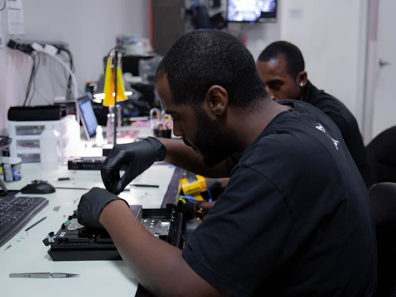 Instructor teaching mainboard circuitry